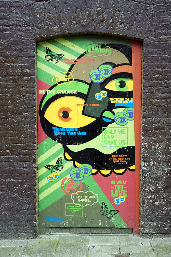Photo 16180: No door. Formed door with many English phrases in green, red, blue and yellow.