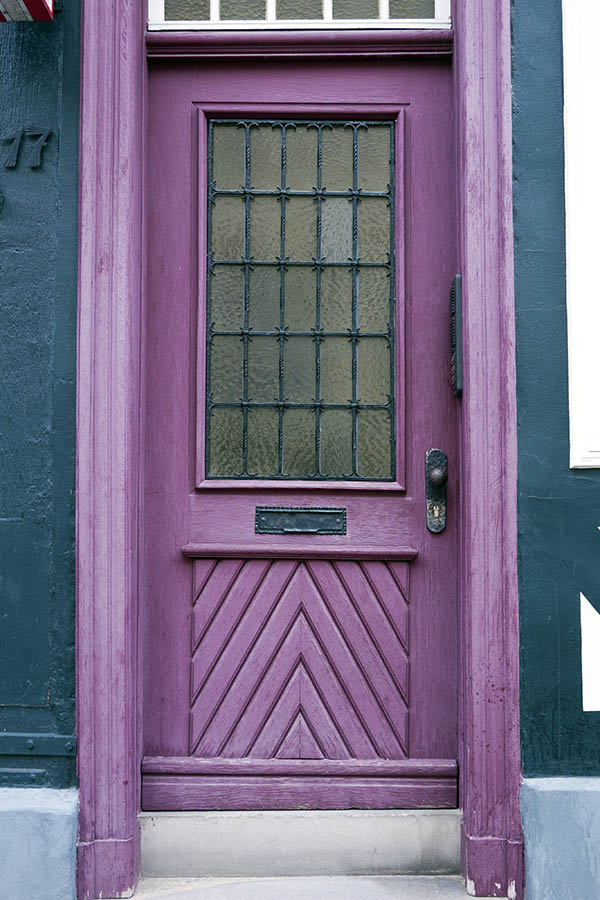 Photo 16224: Panelled, purple door with white top window and black, latticed door light