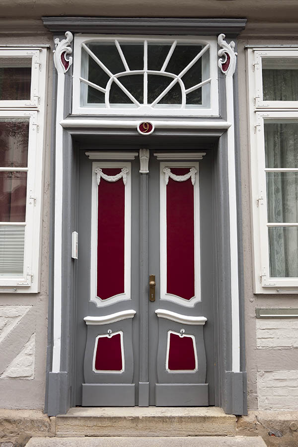 Photo 16271: Panelled, carved, formed, grey, white and red double door with top window