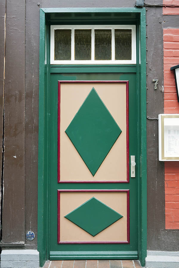 Photo 16304: Panelled, green, red and light brown door with white top window