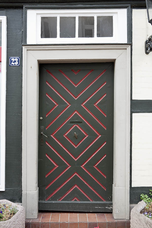 Photo 16308: Panelled, brown, red, grey and white door with top window