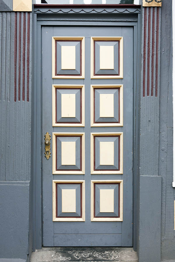 Photo 16324: Panelled, carved, grey, light yellow and red door