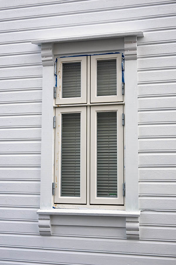 Photo 16693: Narrow, light yellow window with four frames.