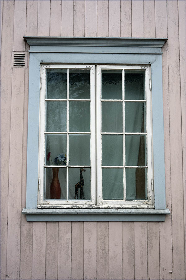 Photo 17197: Worn, white and teal window with two frames and 16 panes