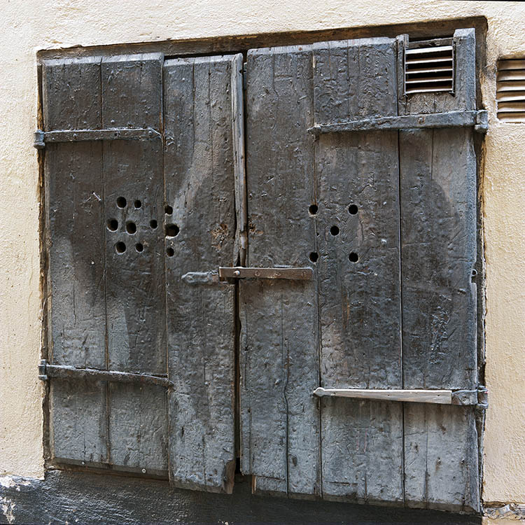 Photo 17738: Worn, unpainted shutters of board