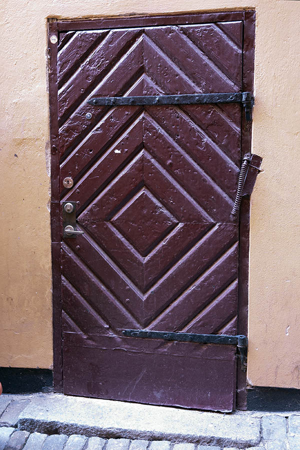 Photo 17739: Worn, purple door of diagonally mounted boards