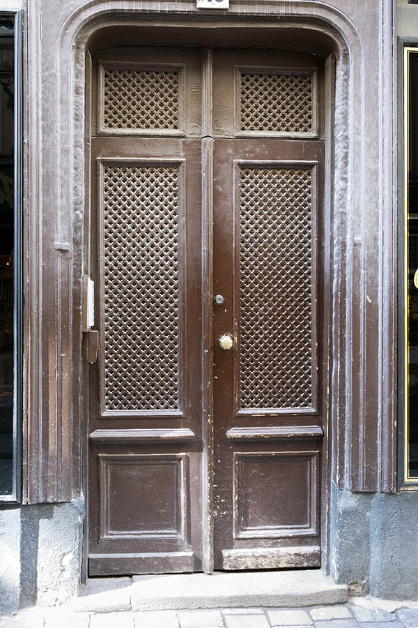 Photo 17810: Worn, panelled, latticed, brown double door