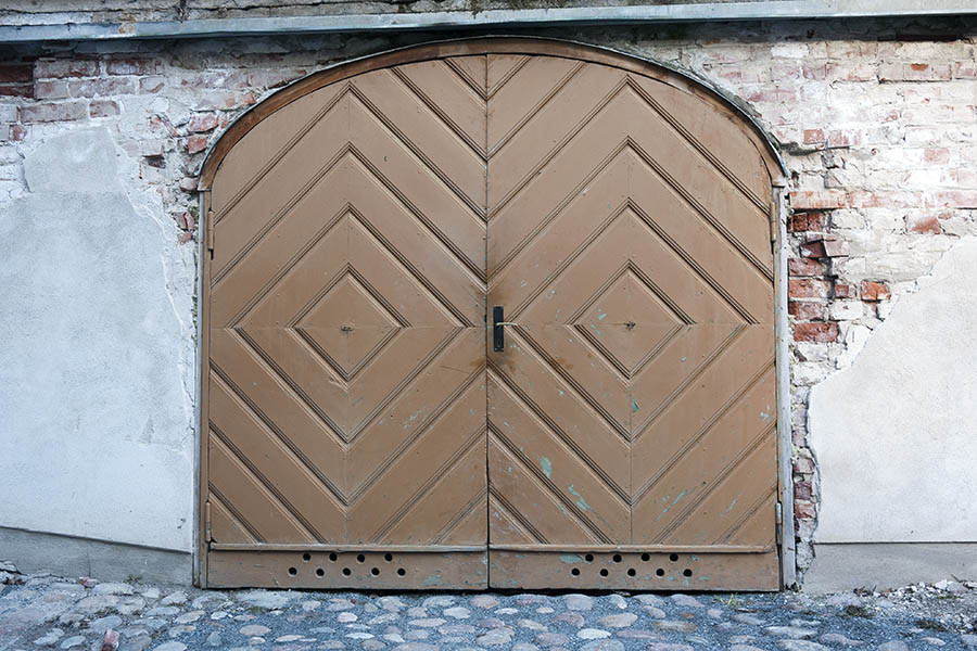 Photo 17991: Formed, light brown double door of diagonally mounted boards