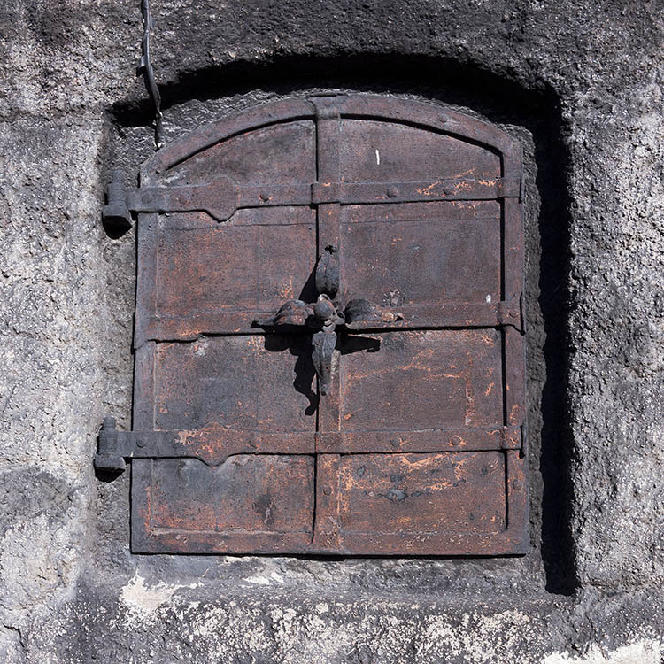 Photo 18003: Tiny, rusty, black metal trapdoor