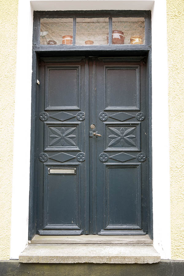 Photo 18566: Panelled, grey, carved double door with top window