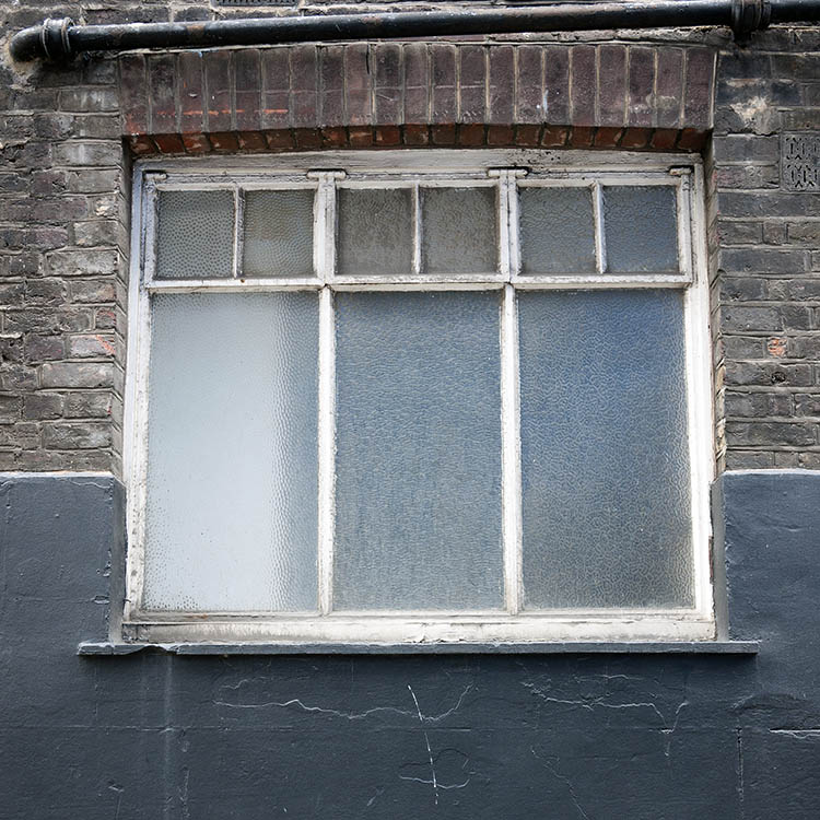 Photo 18888: Worn, white window with six frames and nine panes