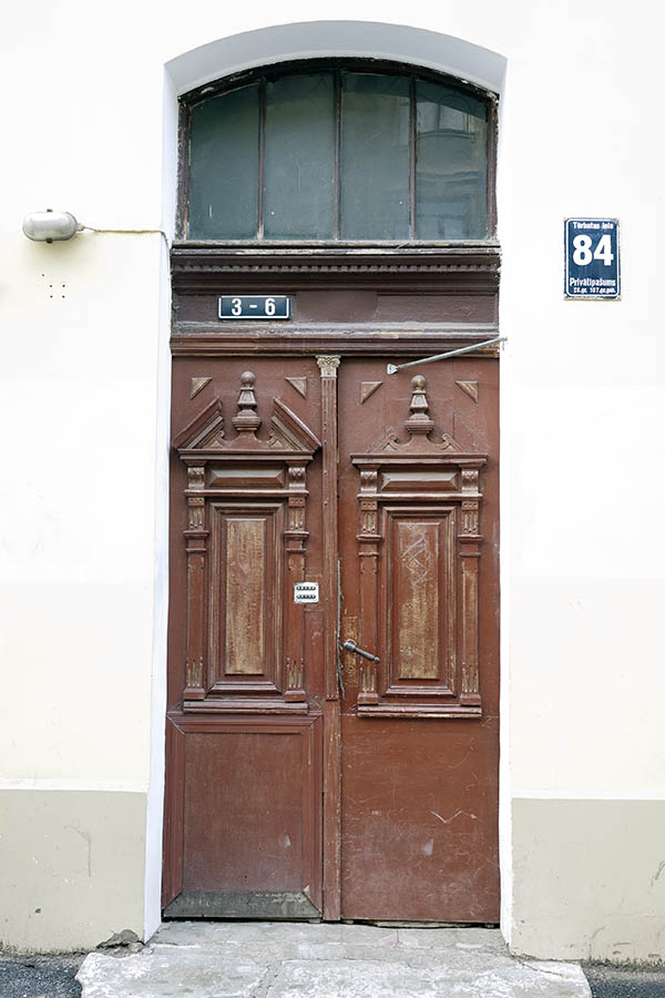 Photo 19015: Panelled, carved, brown double door with fan light