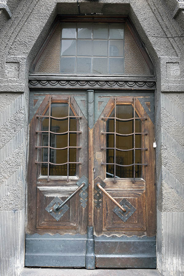 Photo 19086: Worn, panelled, carved, barred, formed, oiled double door with formed top window