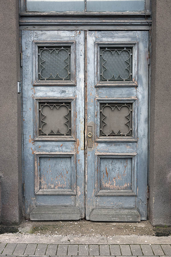 Photo 19494: Worn, latticed, teal double door with top window