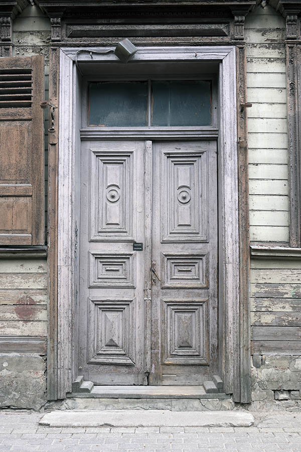 Photo 19714: Worn, panelled, carved, grey double door with top window