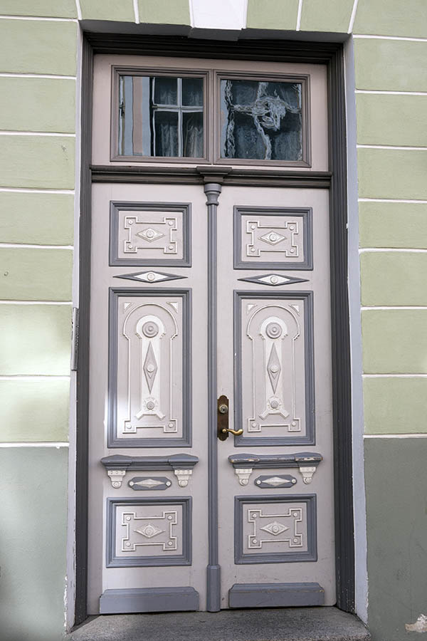 Photo 19957: Panelled, carved, grey, white and dark grey double door with top window