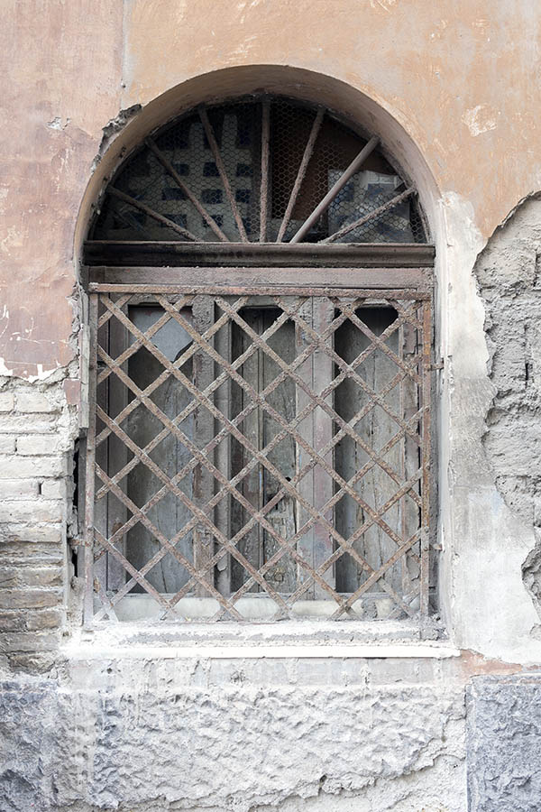 Photo 23944: Decayed, formed, barred, latticed, brown, unpainted, rusty window