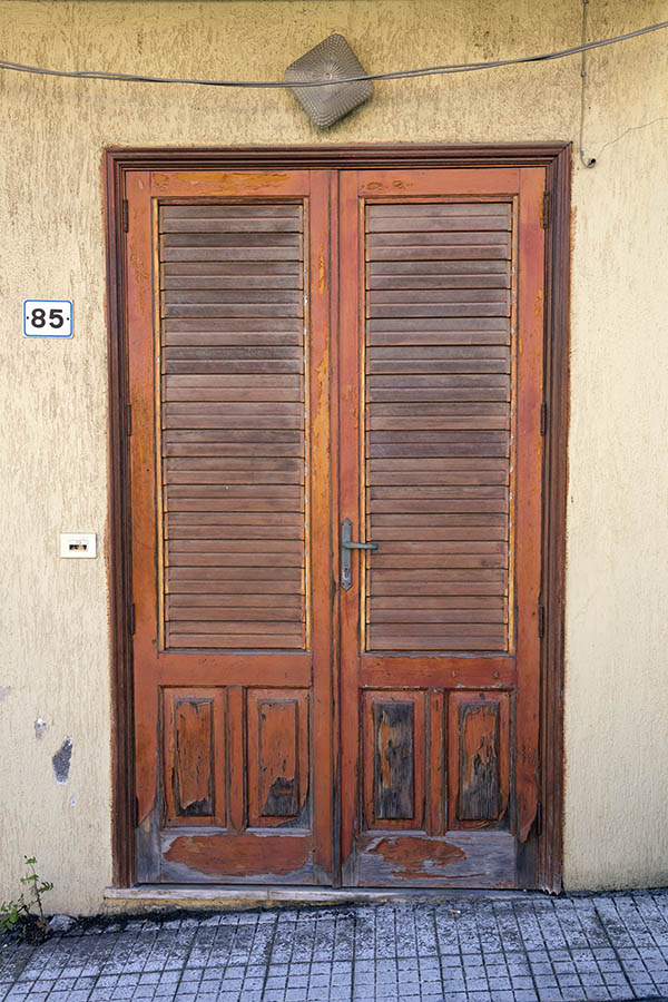 Photo 23967: Worn, panelled, orange double door