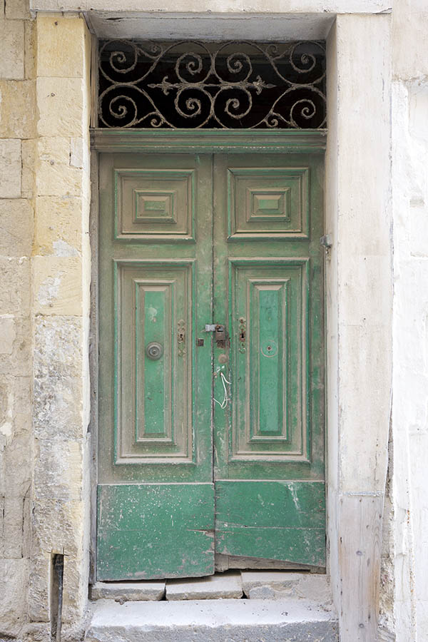 Photo 24037: Decayed, panelled, green double door with latticed top window