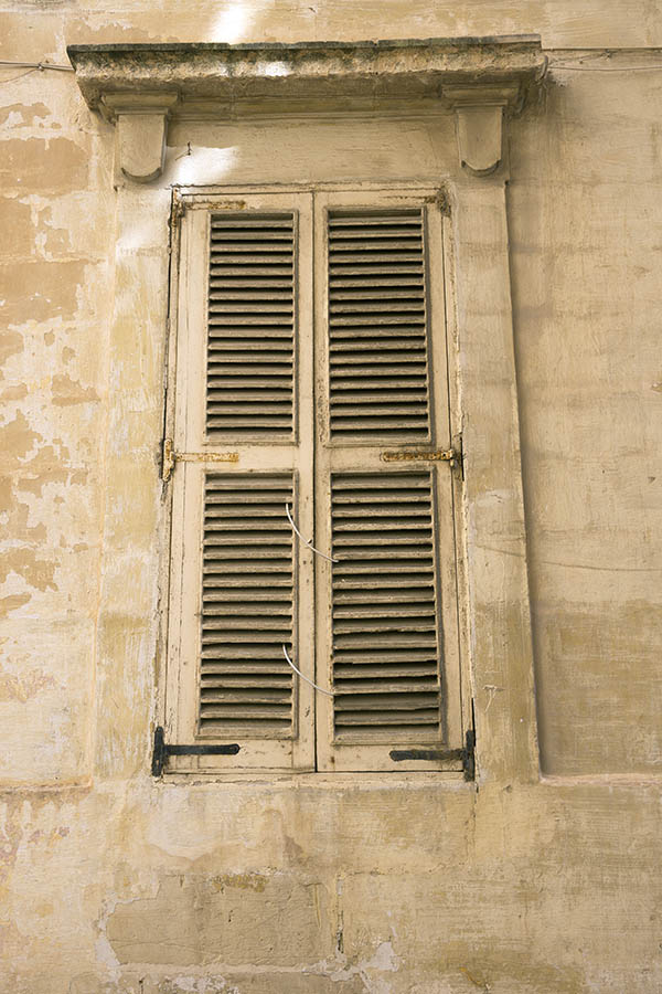 Photo 24057: Worn, narrow, yellow double shutters