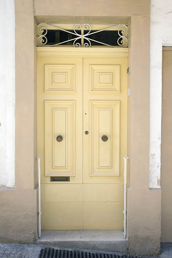 Photo 24174: Panelled, yellow double door with latticed top window