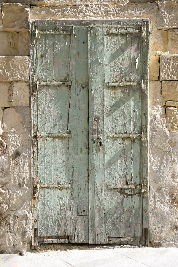 Photo 24177: Narrow, decayed, light green double door of planks