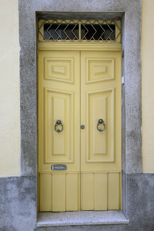 Photo 24259: Panelled, yellow double door with latticed top window
