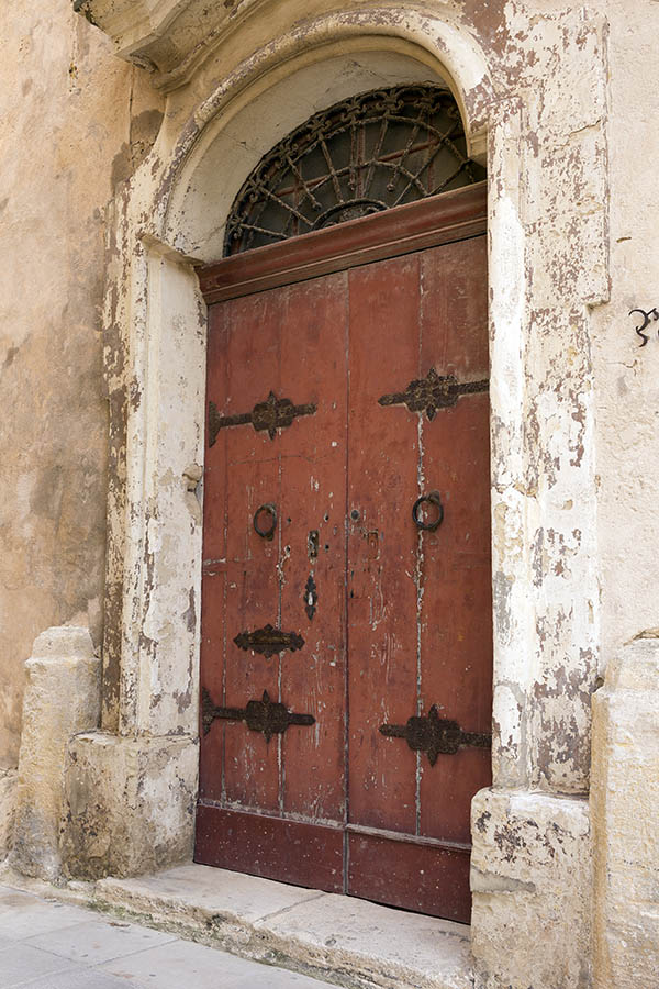 Photo 24280: Worn, brown gate made of planks with a latticed fan light