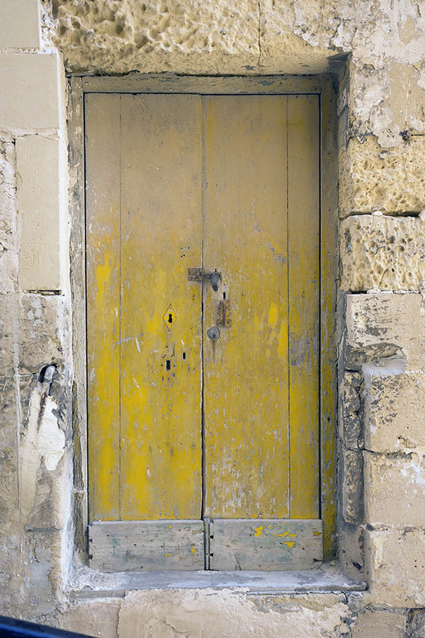 Photo 24318: Worn, yellow double door made of planks.