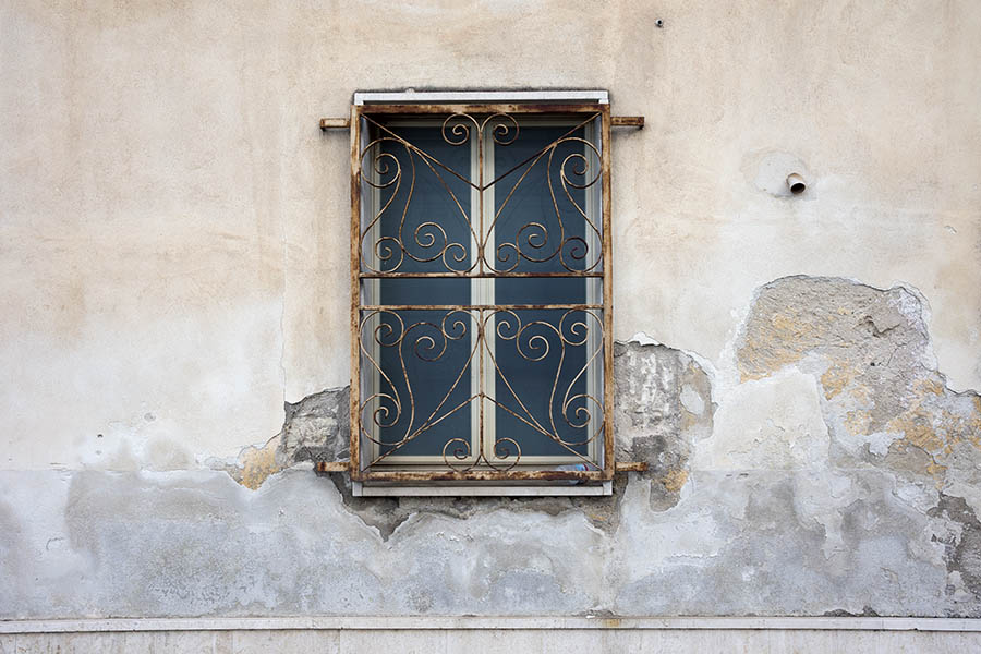 Photo 24431: Latticed, light yellow window with two frames