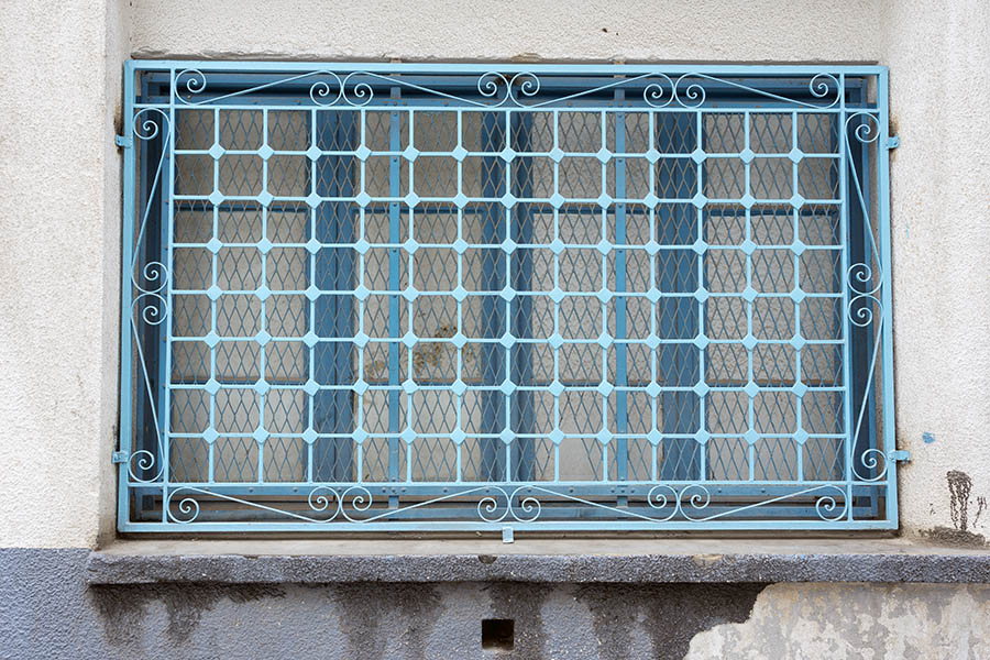 Photo 24549: Light blue window with 12 panes covered by a light blue lattice
