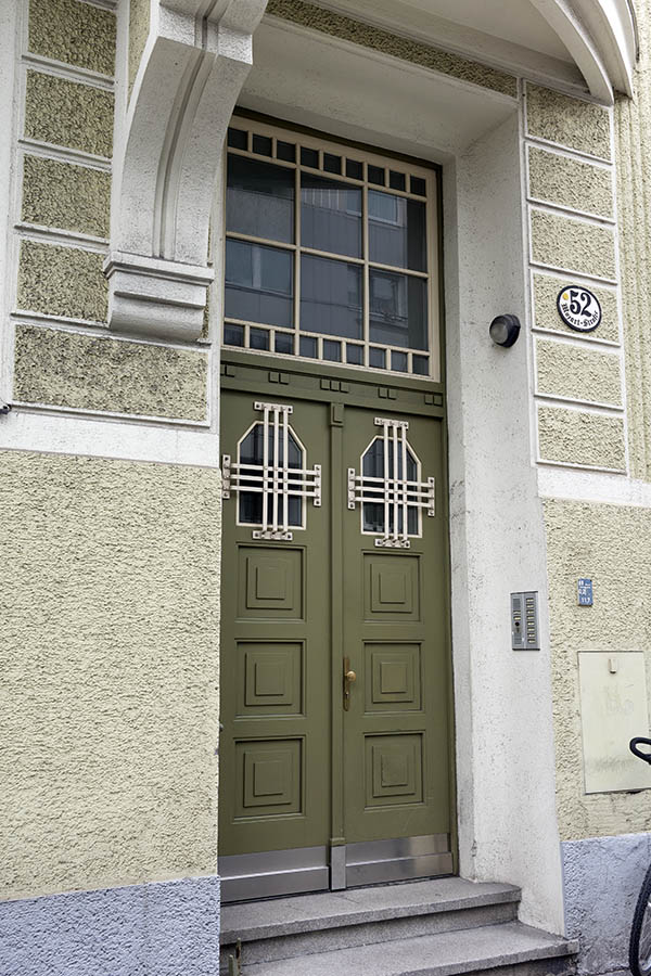 Photo 24930: Panelled, green double door with barred fan lights and a large door light