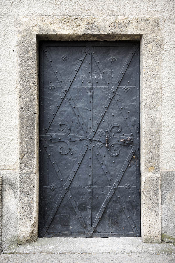 Photo 24993: Worn, black metal plate door