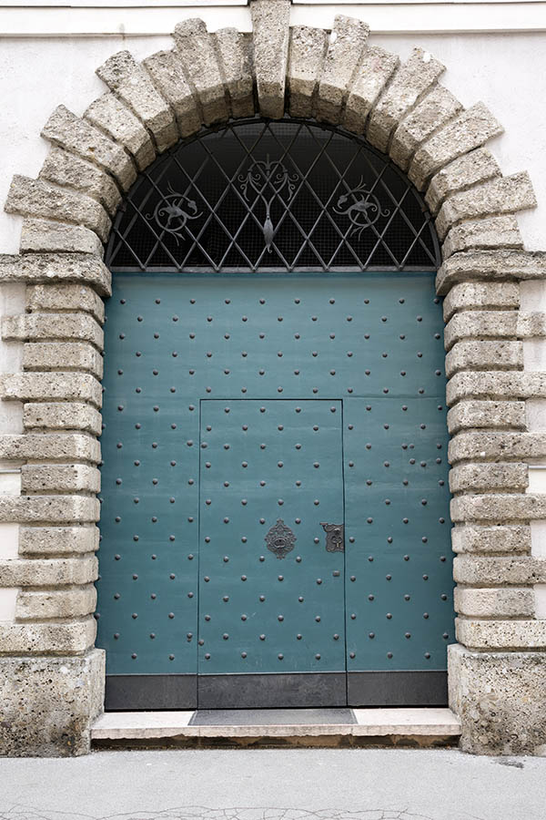 Photo 25000: Teal gate of boards with nails and latticed, barred fan light