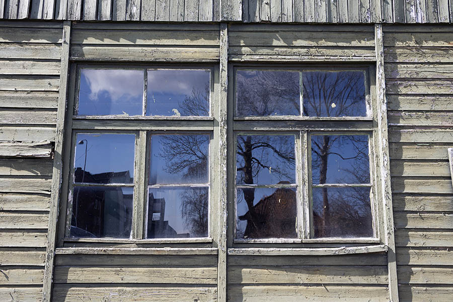 Photo 25004: Two decayed, green windows with six panes and three frames each