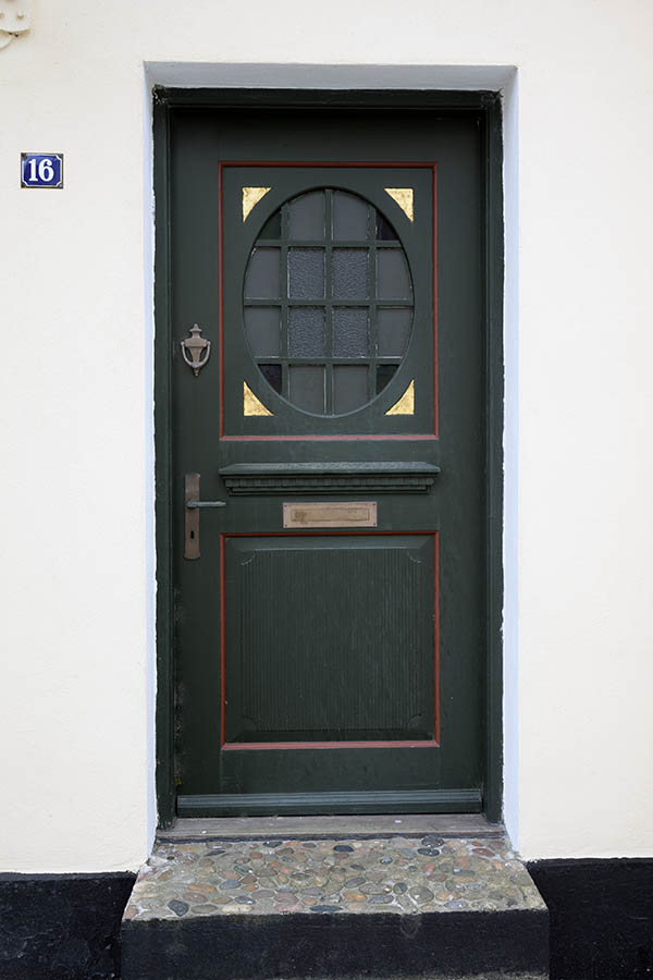 Photo 25062: Panelled, carved, dark green, red and yellow door with formed door light