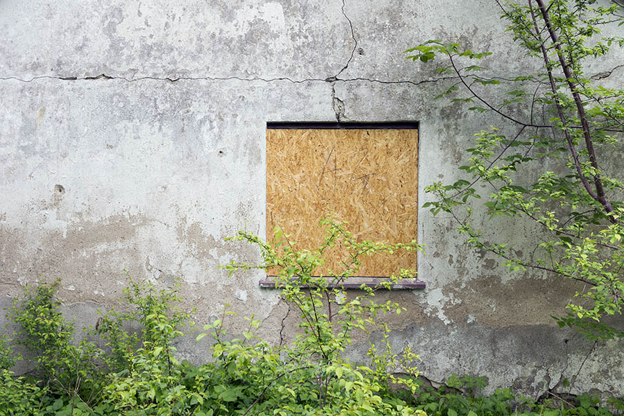 Photo 25160: No window: A window covered with unpainted plywood