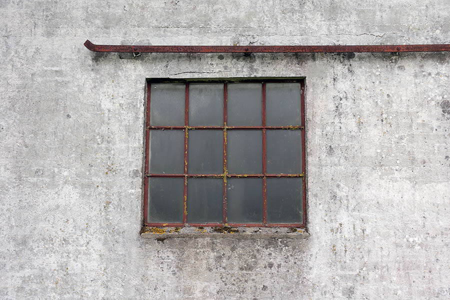 Photo 25172: Worn, rusty, brown metal stable window