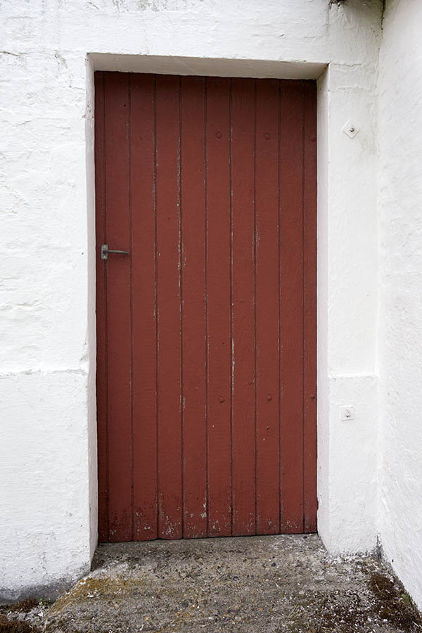 Photo 25187: Worn, red door of boards
