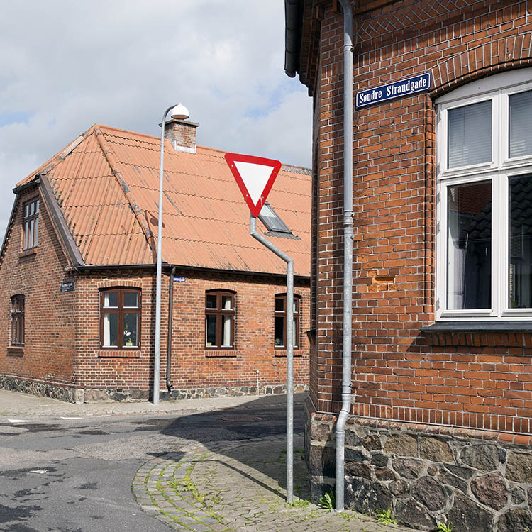 Photo 25239: Facade of two red brick houses on a street corner