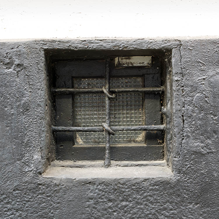 Photo 25339: Little, black, barred cellar window