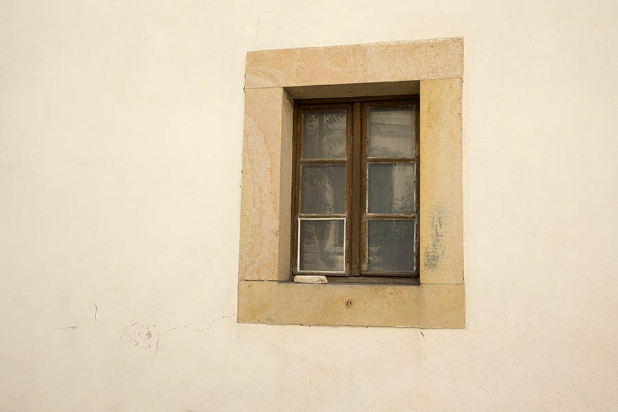 Photo 25421: Facade with a brown window with two frames and six panes mounted in a large, sandstone frame