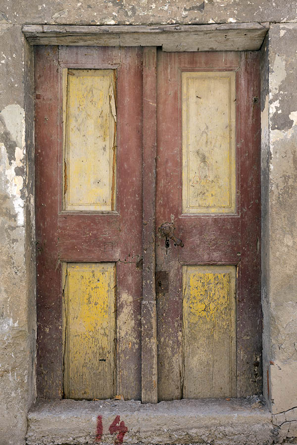 Photo 25467: Decayed, panelled, narrow, red and yellow double door