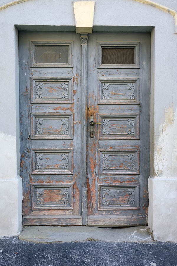 Photo 25479: Worn, panelled, carved, teal double door with door lights