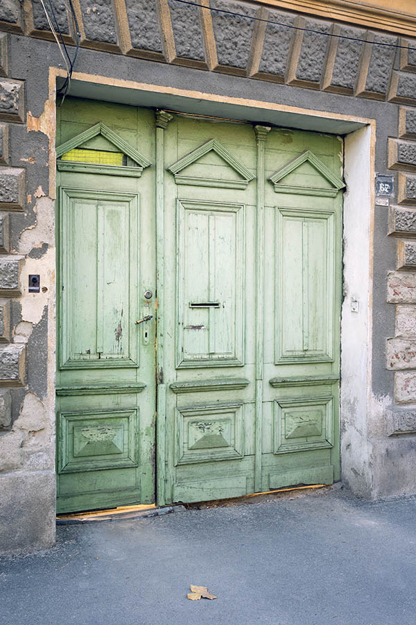 Photo 25657: Worn, panelled, green gate in three parts
