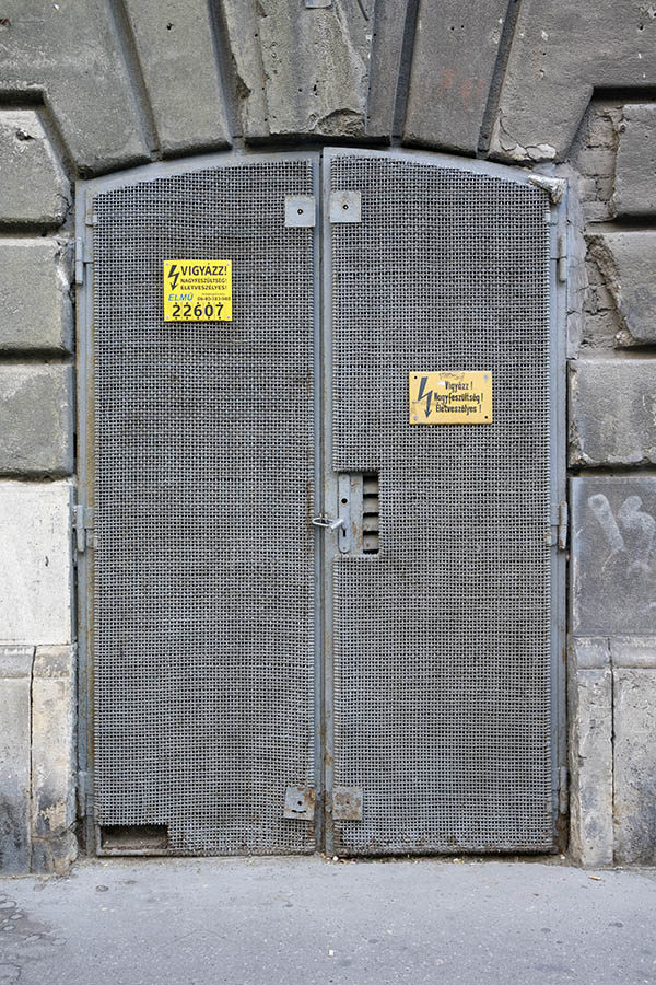 Photo 26036: Formed, latticed, grey metal double door
