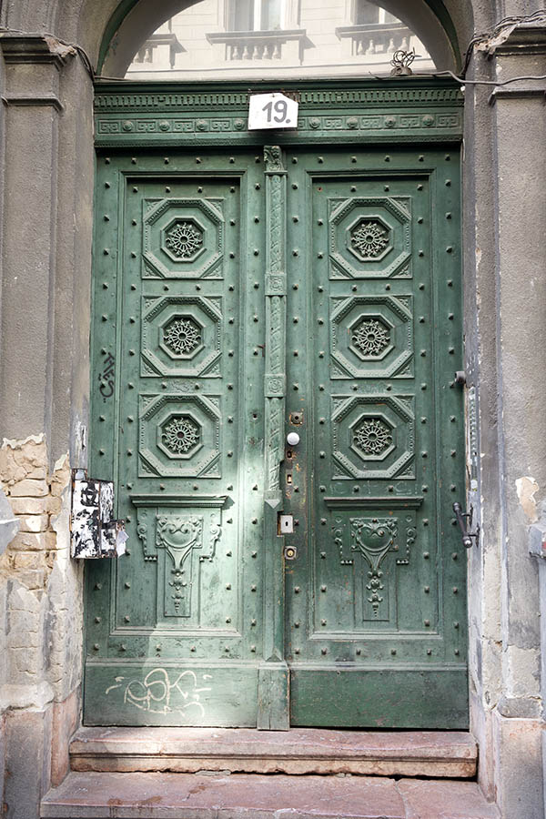 Photo 26084: Panelled, carved, green double door with fan light