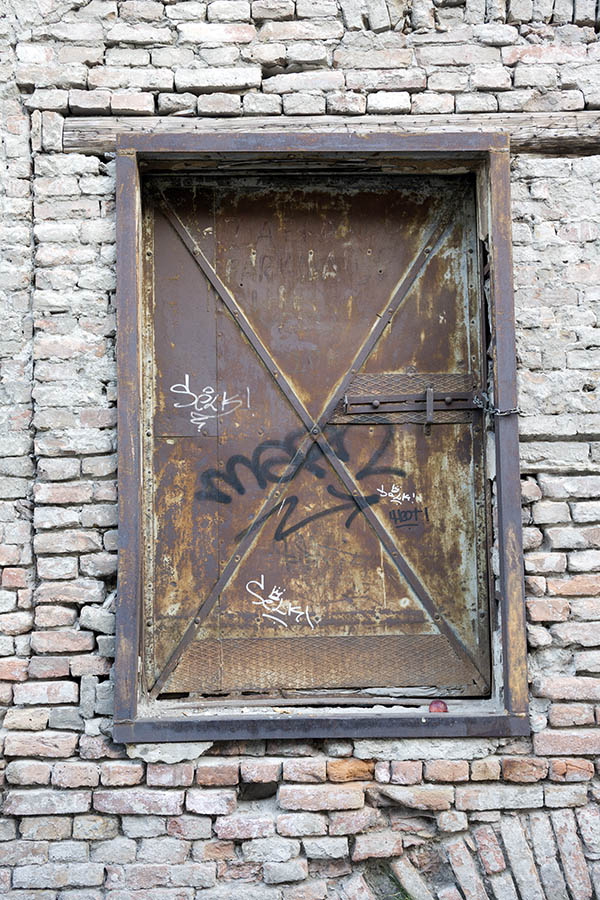 Photo 26115: Grey, brown, and rusty metal hatchdoor