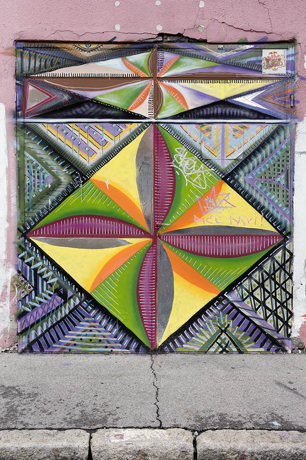 Photo 26153: Metal plate double door with a large graffitti in yellow, orange, green, red, white, blue, and purpl
