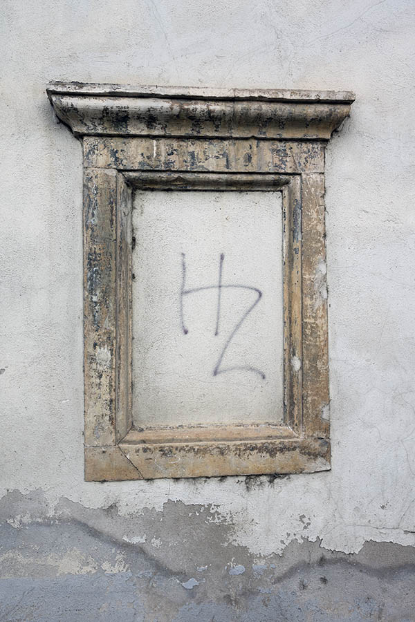 Photo 26173: No window. A worn, yellow sandstone frame